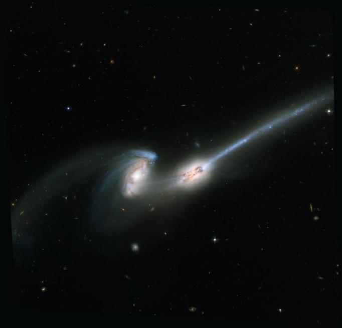 The Mice, as these colliding galaxies are called, are a pair of spiral galaxies seen about 160 million years after their closest encounter. Gravity has drawn stars and gas out of the galaxies into long tails.  Credit: NASA, H. Ford (JHU), G. Illingworth (UCSC/LO), M.Clampin (STScI), G. Hartig (STScI), the ACS Science Team, and ESA