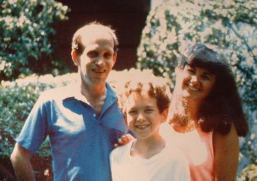 Dan, at the age of 11, poses with his mom and dad.